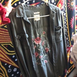 green army jacket with floral pattern